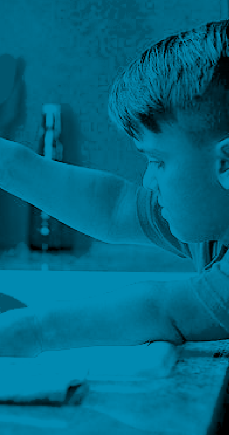 a boy with Achondroplasia washing a bowl in the kitchen sink